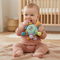 Balle sensorielle pour bébé avec anneau de dentition en silicone et hochet